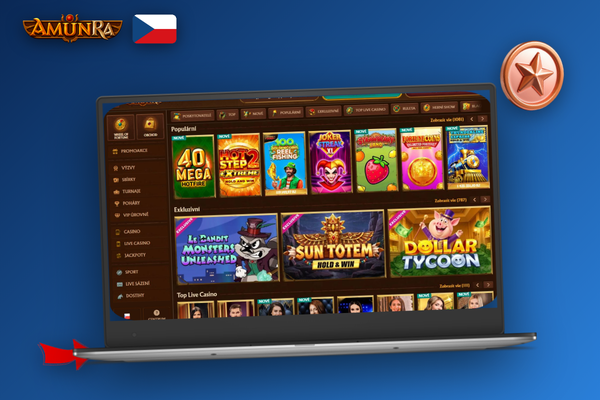 Starší notebook se spuštěným AmunRa Casino pro počítač v útulné domácí pracovně